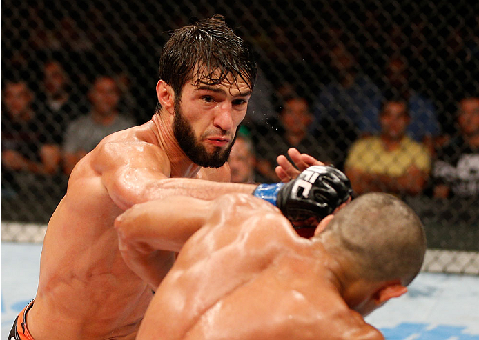 JARAGUA DO SUL, BRAZIL - FEBRUARY 15: (L-R) Zubaira Tukhugov punches Douglas Silva de Andrade in their featherweight fight during the UFC Fight Night event at Arena Jaragua on February 15, 2014 in Jaragua do Sul, Santa Catarina, Brazil. (Photo by Josh Hedges/Zuffa LLC/Zuffa LLC via Getty Images)