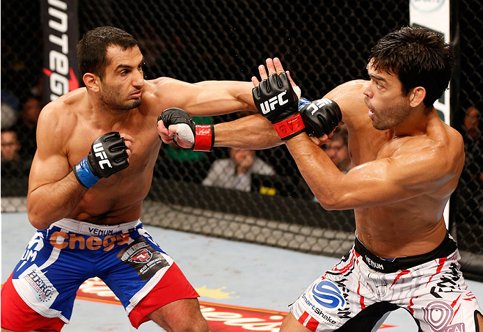 JARAGUA DO SUL, BRAZIL - FEBRUARY 15:  (L-R) Gegard Mousasi punches Lyoto Machida in their middleweight fight during the UFC Fight Night event at Arena Jaragua on February 15, 2014 in Jaragua do Sul, Santa Catarina, Brazil. (Photo by Josh Hedges/Zuffa LLC/Zuffa LLC via Getty Images)