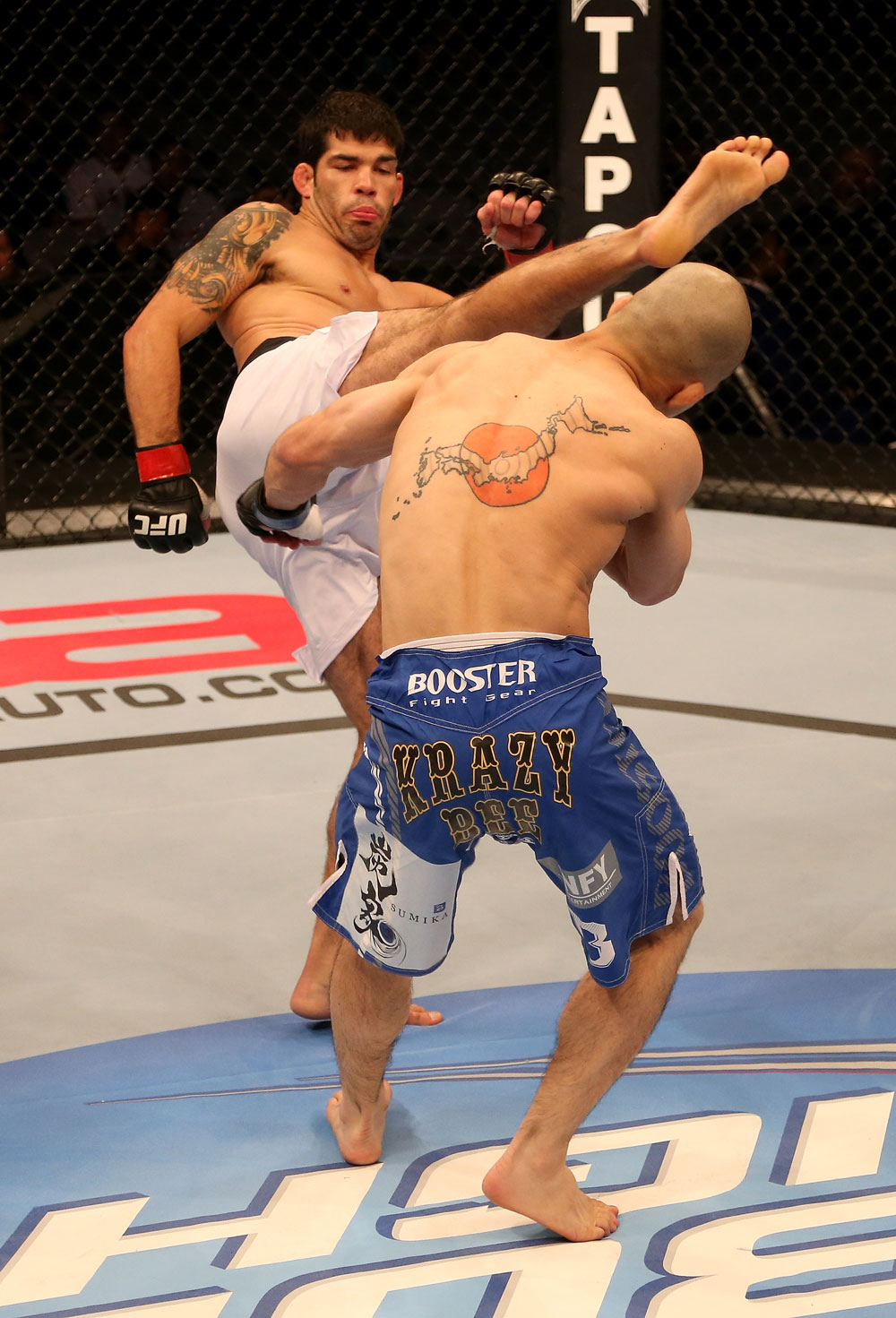 SAN JOSE, CA - JULY 11: Raphael Assuncao (white shorts) kicks Issei Tamura during their bantamweight bout at HP Pavilion on July 11, 2012 in San Jose, California. (Photo by Ezra Shaw/Zuffa LLC/Zuffa LLC via Getty Images) *** Local Caption *** Issei Tamura; Raphael Assuncao