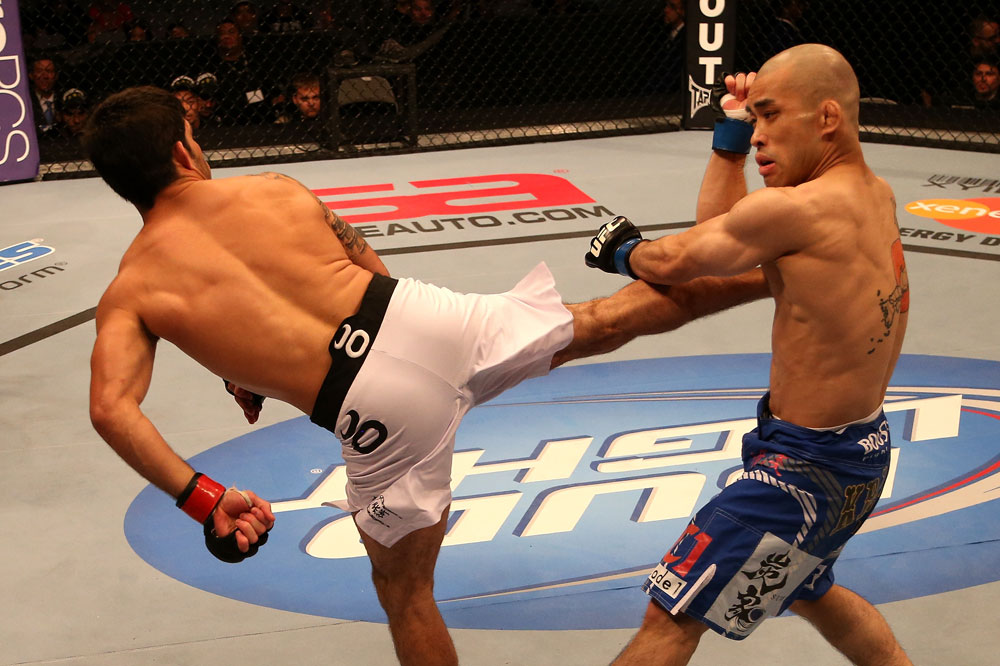 SAN JOSE, CA - JULY 11: (L-R) Raphael Assuncao kicks Issei Tamura during their bantamweight bout at HP Pavilion on July 11, 2012 in San Jose, California. (Photo by Ezra Shaw/Zuffa LLC/Zuffa LLC via Getty Images) *** Local Caption *** Issei Tamura; Raphael Assuncao