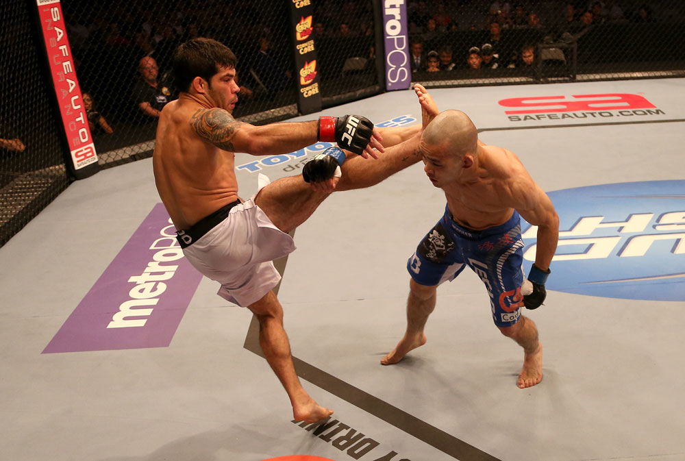 SAN JOSE, CA - JULY 11: (L-R) Raphael Assuncao kicks Issei Tamura during their bantamweight bout at HP Pavilion on July 11, 2012 in San Jose, California. (Photo by Ezra Shaw/Zuffa LLC/Zuffa LLC via Getty Images) *** Local Caption *** Issei Tamura; Raphael Assuncao