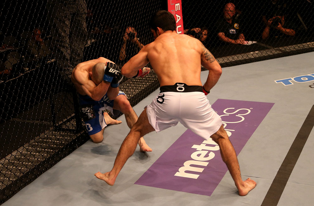SAN JOSE, CA - JULY 11: (R-L) Raphael Assuncao punches Issei Tamura during their bantamweight bout at HP Pavilion on July 11, 2012 in San Jose, California. (Photo by Ezra Shaw/Zuffa LLC/Zuffa LLC via Getty Images) *** Local Caption *** Issei Tamura; Raphael Assuncao