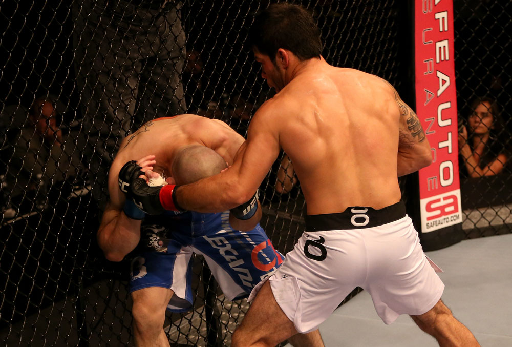 SAN JOSE, CA - JULY 11: (R-L) Raphael Assuncao punches Issei Tamura during their bantamweight bout at HP Pavilion on July 11, 2012 in San Jose, California. (Photo by Ezra Shaw/Zuffa LLC/Zuffa LLC via Getty Images) *** Local Caption *** Issei Tamura; Raphael Assuncao