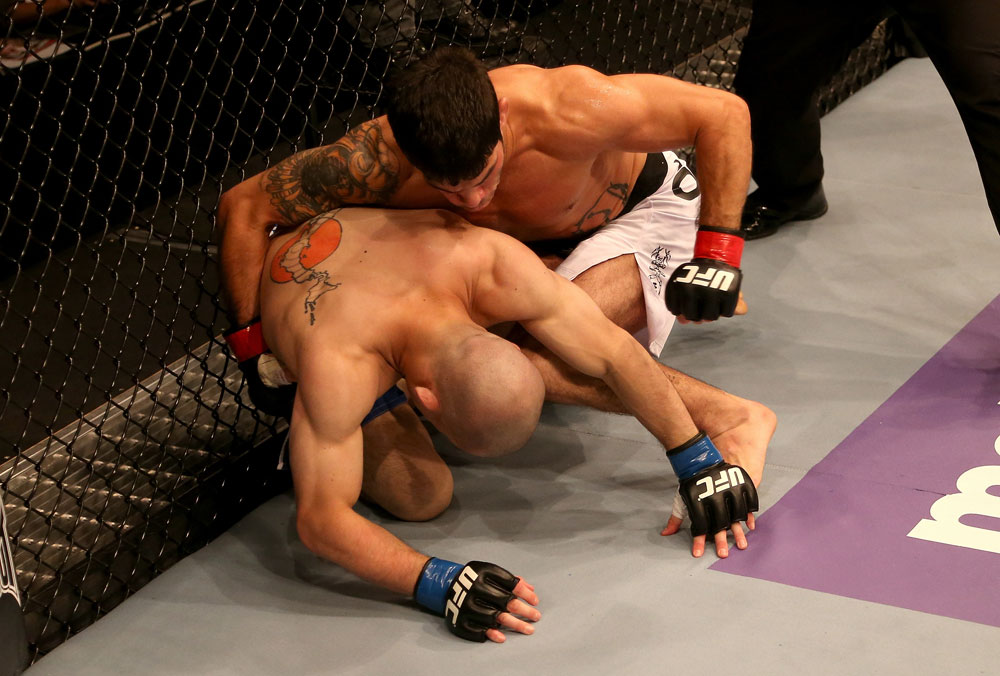 SAN JOSE, CA - JULY 11: (R-L) Raphael Assuncao punches Issei Tamura during their bantamweight bout at HP Pavilion on July 11, 2012 in San Jose, California. (Photo by Ezra Shaw/Zuffa LLC/Zuffa LLC via Getty Images) *** Local Caption *** Issei Tamura; Raphael Assuncao
