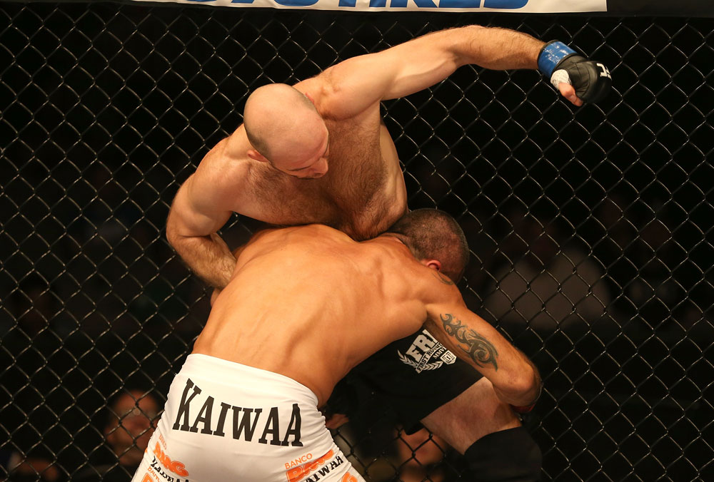 SAN JOSE, CA - JULY 11: Dan Stittgen (blue gloves) punches Marcelo Guimaraes during their welterweight bout at HP Pavilion on July 11, 2012 in San Jose, California. (Photo by Ezra Shaw/Zuffa LLC/Zuffa LLC via Getty Images) *** Local Caption *** Marcelo Guimaraes; Dan Stittgen