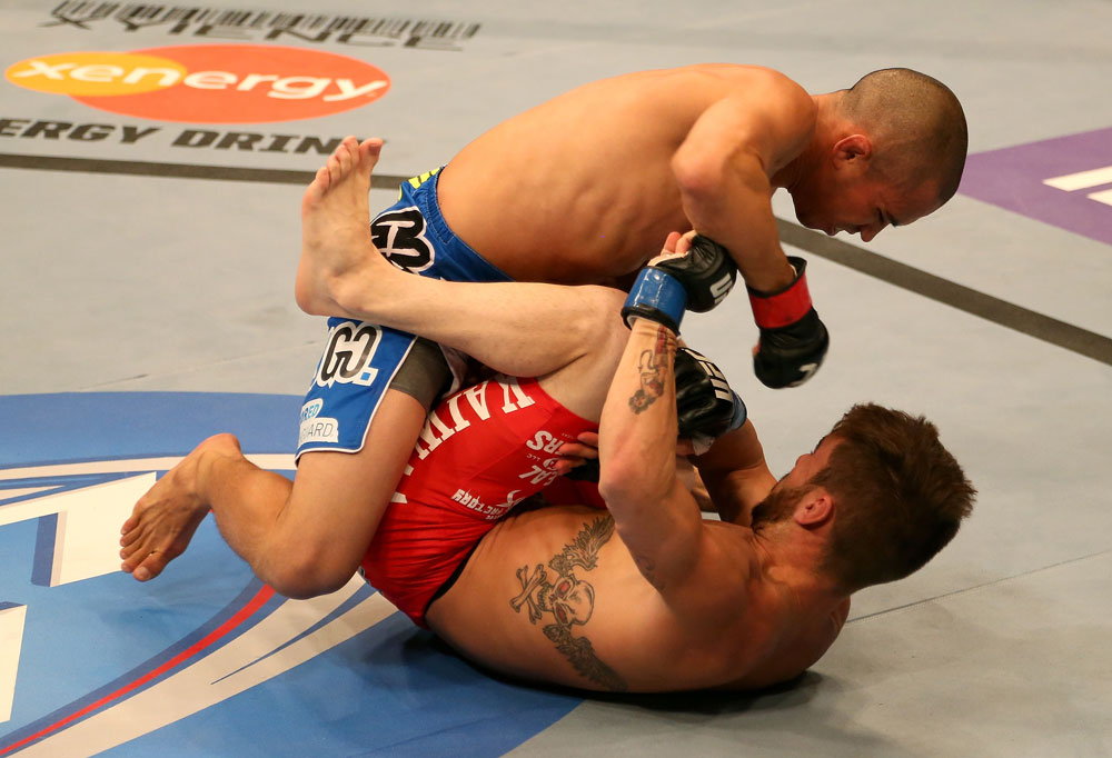 SAN JOSE, CA - JULY 11: Chris Cariaso (top) punches Josh Ferguson during their flyweight bout at HP Pavilion on July 11, 2012 in San Jose, California. (Photo by Ezra Shaw/Zuffa LLC/Zuffa LLC via Getty Images) *** Local Caption *** Chris Cariaso; Josh Ferguson