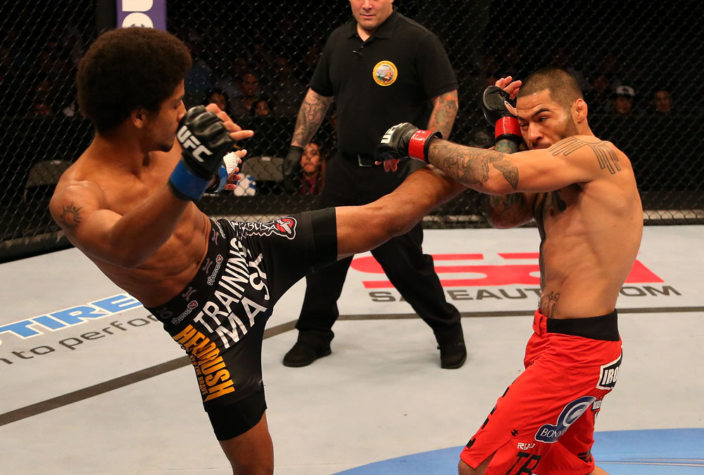 SAN JOSE, CA - JULY 11: (L-R) Alex Caceres kicks Damacio Page during their bantamweight bout at HP Pavilion on July 11, 2012 in San Jose, California. (Photo by Ezra Shaw/Zuffa LLC/Zuffa LLC via Getty Images) *** Local Caption *** Damacio Page; Alex Caceres