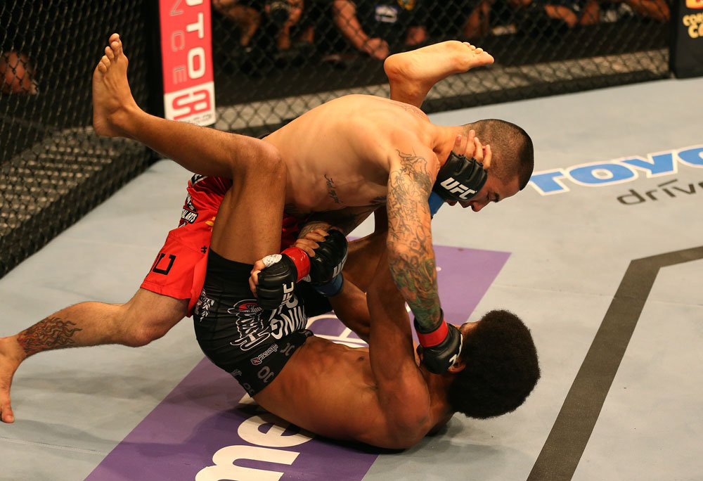 SAN JOSE, CA - JULY 11: Damacio Page (top) punches Alex Caceres during their bantamweight bout at HP Pavilion on July 11, 2012 in San Jose, California. (Photo by Ezra Shaw/Zuffa LLC/Zuffa LLC via Getty Images) *** Local Caption *** Damacio Page; Alex Caceres