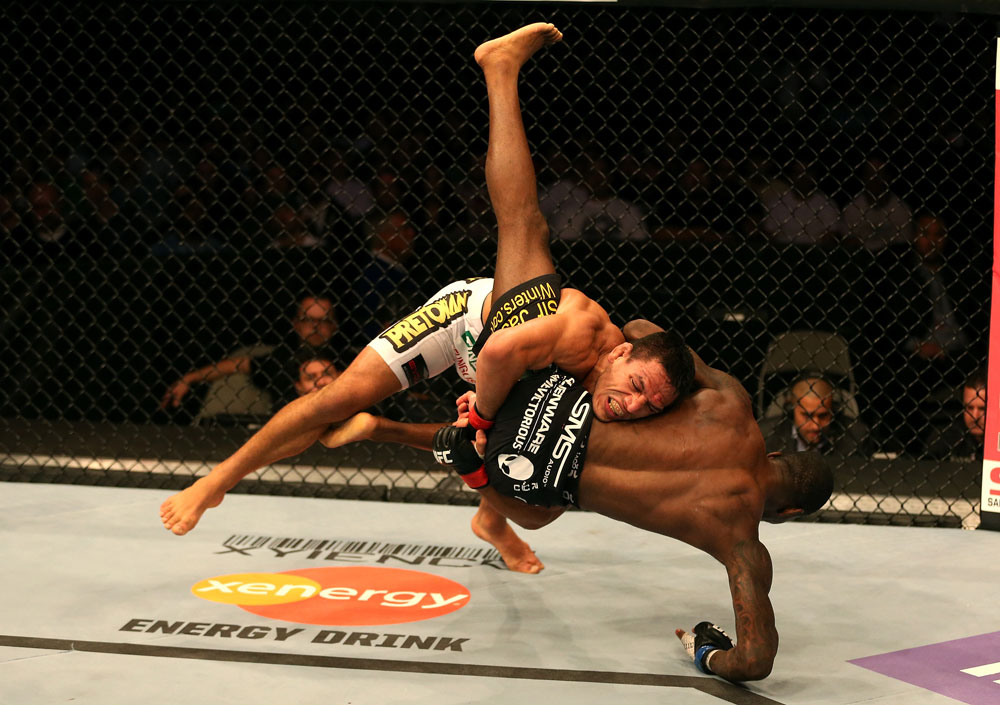 SAN JOSE, CA - JULY 11: Rafael dos Anjos (white shorts) takes down Anthony Njokuani during their lightweight bout at HP Pavilion on July 11, 2012 in San Jose, California. (Photo by Ezra Shaw/Zuffa LLC/Zuffa LLC via Getty Images) *** Local Caption *** Rafael Dos Anjos; Anthony Njokuani