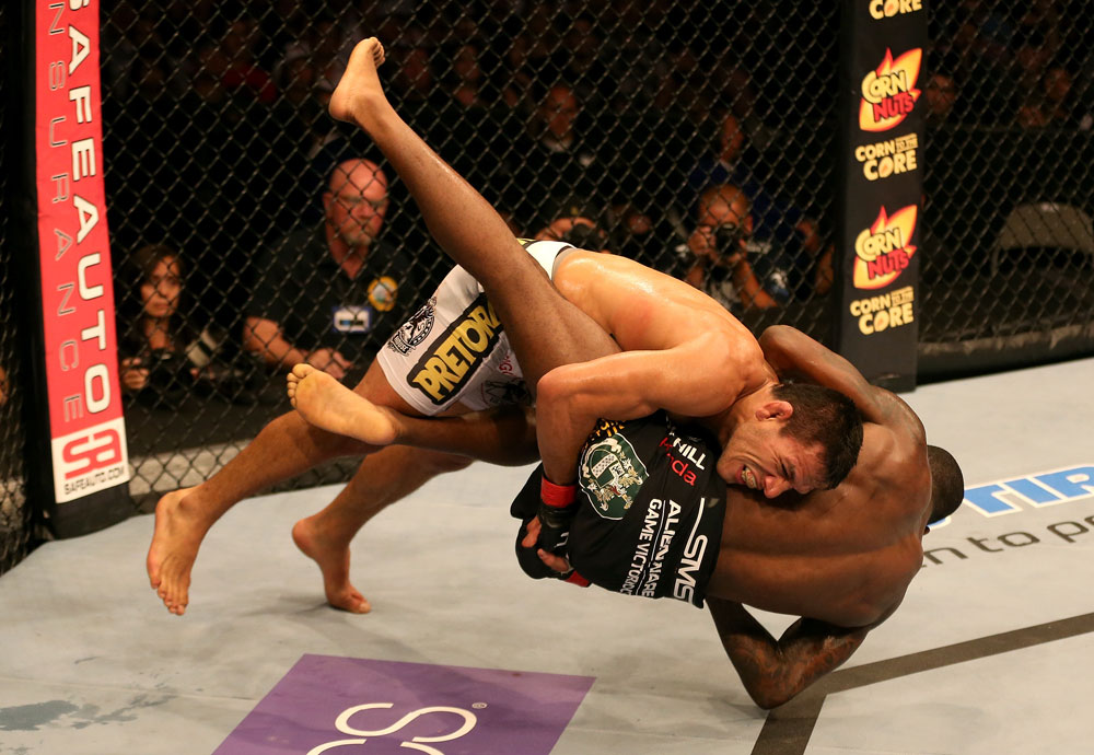 SAN JOSE, CA - JULY 11: Rafael dos Anjos (white shorts) takes down Anthony Njokuani during their lightweight bout at HP Pavilion on July 11, 2012 in San Jose, California. (Photo by Ezra Shaw/Zuffa LLC/Zuffa LLC via Getty Images) *** Local Caption *** Rafael Dos Anjos; Anthony Njokuani