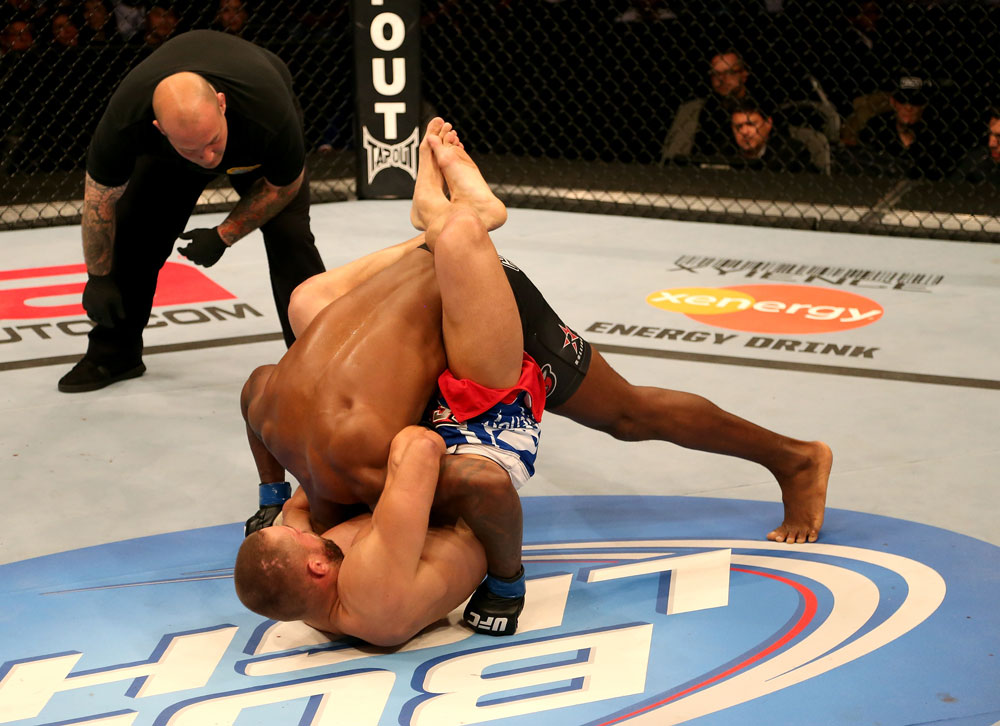 SAN JOSE, CA - JULY 11: Karlos Vemola (bottom) attempts to submit Francis Carmont as referee Josh Rosenthal looks on during their middleweight bout at HP Pavilion on July 11, 2012 in San Jose, California. (Photo by Ezra Shaw/Zuffa LLC/Zuffa LLC via Getty Images) *** Local Caption *** Karlos Vemola; Francis Carmont; Josh Rosenthal