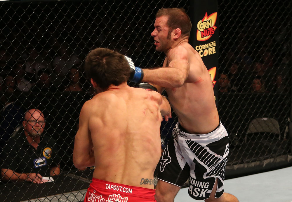 SAN JOSE, CA - JULY 11: Kenny Robertson (right) punches Aaron Simpson during their welterweight bout at HP Pavilion on July 11, 2012 in San Jose, California. (Photo by Ezra Shaw/Zuffa LLC/Zuffa LLC via Getty Images) *** Local Caption *** Aaron Simpson; Kenny Robertson