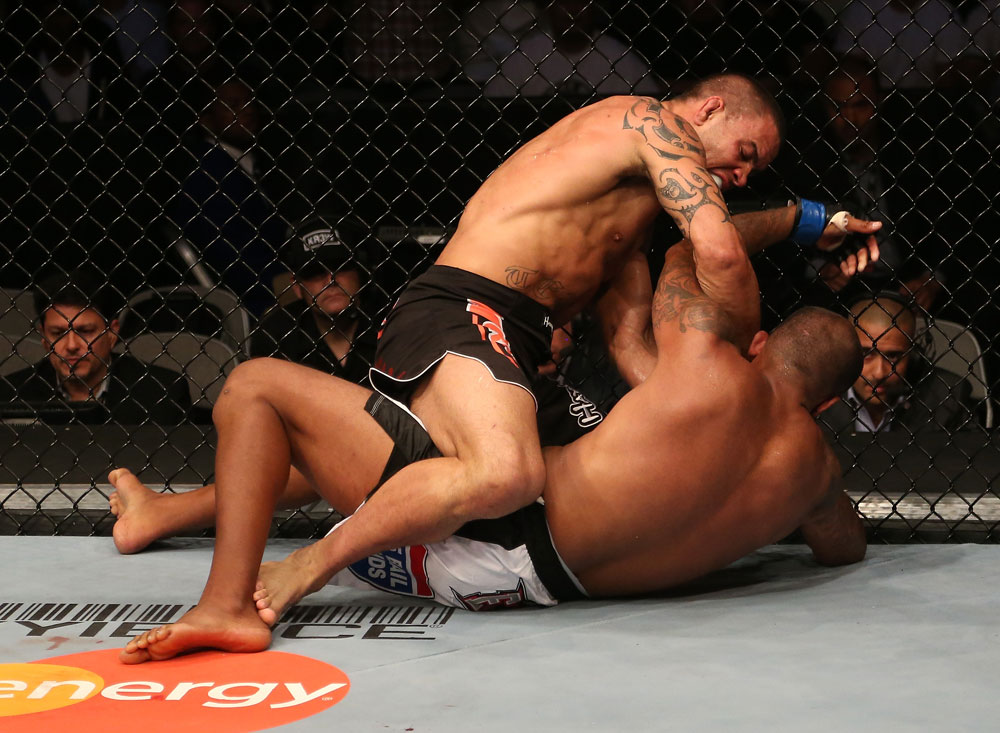 SAN JOSE, CA - JULY 11: James Te Huna (top) punches Joey Beltran during their light heavyweight bout at HP Pavilion on July 11, 2012 in San Jose, California. (Photo by Ezra Shaw/Zuffa LLC/Zuffa LLC via Getty Images) *** Local Caption *** James Te Huna; Joey Beltran