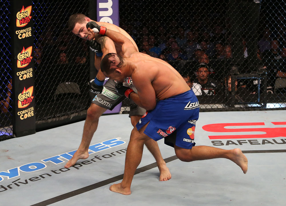 SAN JOSE, CA - JULY 11: (R-L) Mark Munoz punches Chris Weidman during their middleweight bout at HP Pavilion on July 11, 2012 in San Jose, California. (Photo by Ezra Shaw/Zuffa LLC/Zuffa LLC via Getty Images) *** Local Caption *** Mark Munoz; Chris Weidman