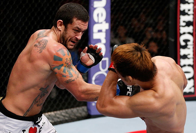 MACAU, MACAU - NOVEMBER 10: (L-R) Tom DeBlass punches Riki Fukuda during their middleweight bout at the UFC Macao event inside CotaiArena on November 10, 2012 in Macau, Macau. (Photo by Josh Hedges/Zuffa LLC/Zuffa LLC via Getty Images)