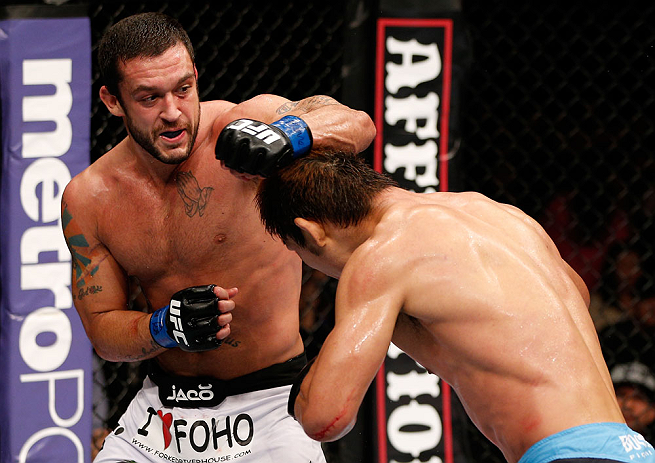 MACAU, MACAU - NOVEMBER 10: (L-R) Tom DeBlass punches Riki Fukuda during their middleweight bout at the UFC Macao event inside CotaiArena on November 10, 2012 in Macau, Macau. (Photo by Josh Hedges/Zuffa LLC/Zuffa LLC via Getty Images)