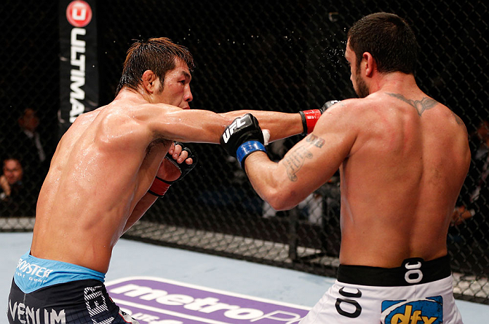 MACAU, MACAU - NOVEMBER 10:  (L-R) Riki Fukuda punches Tom DeBlass during their middleweight bout at the UFC Macao event inside CotaiArena on November 10, 2012 in Macau, Macau.  (Photo by Josh Hedges/Zuffa LLC/Zuffa LLC via Getty Images)