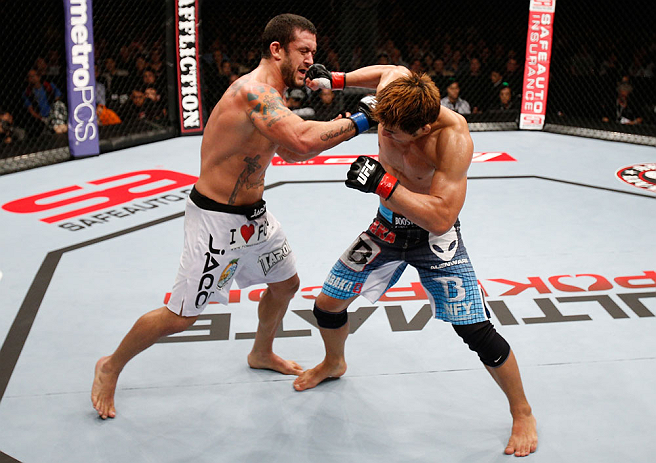 MACAU, MACAU - NOVEMBER 10:  (L-R) Tom DeBlass punches Riki Fukuda during their middleweight bout at the UFC Macao event inside CotaiArena on November 10, 2012 in Macau, Macau.  (Photo by Josh Hedges/Zuffa LLC/Zuffa LLC via Getty Images)