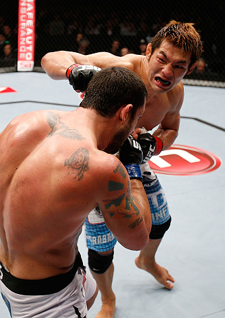 MACAU, MACAU - NOVEMBER 10: (R-L) Riki Fukuda punches Tom DeBlass during their middleweight bout at the UFC Macao event inside CotaiArena on November 10, 2012 in Macau, Macau. (Photo by Josh Hedges/Zuffa LLC/Zuffa LLC via Getty Images)
