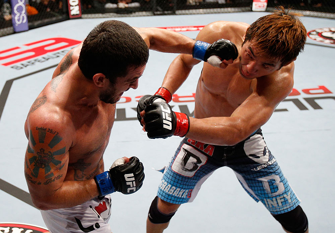 MACAU, MACAU - NOVEMBER 10: (L-R) Tom DeBlass punches Riki Fukuda during their middleweight bout at the UFC Macao event inside CotaiArena on November 10, 2012 in Macau, Macau. (Photo by Josh Hedges/Zuffa LLC/Zuffa LLC via Getty Images)