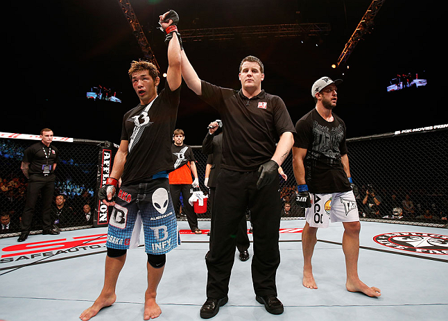 MACAU, MACAU - NOVEMBER 10: Riki Fukuda (L) reacts after defeating Tom DeBlass during their middleweight bout at the UFC Macao event inside CotaiArena on November 10, 2012 in Macau, Macau. (Photo by Josh Hedges/Zuffa LLC/Zuffa LLC via Getty Images)