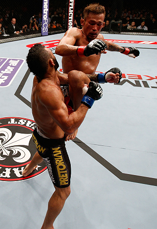 MACAU, MACAU - NOVEMBER 10: (R-L) Yasuhiro Urushitani lands a flying knee against John Lineker during their flyweight bout at the UFC Macao event inside CotaiArena on November 10, 2012 in Macau, Macau. (Photo by Josh Hedges/Zuffa LLC/Zuffa LLC via Getty Images)