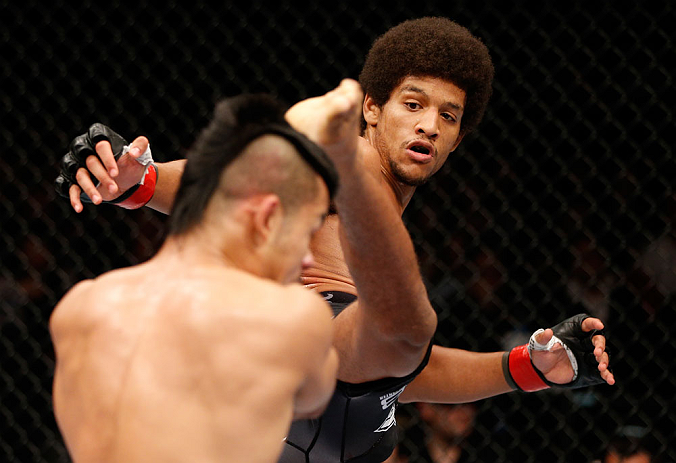 MACAU, MACAU - NOVEMBER 10:  (R-L) Alex Caceres kicks Motonobu Tezuka during their bantamweight bout at the UFC Macao event inside CotaiArena on November 10, 2012 in Macau, Macau.  (Photo by Josh Hedges/Zuffa LLC/Zuffa LLC via Getty Images)