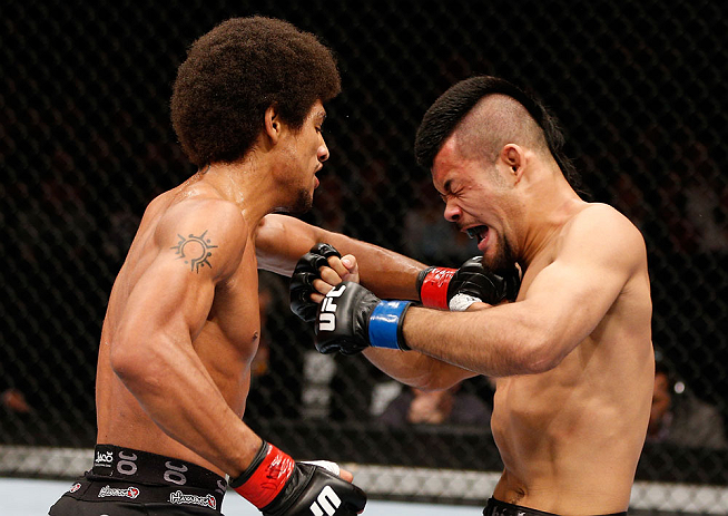 MACAU, MACAU - NOVEMBER 10:  (L-R) Alex Caceres punches Motonobu Tezuka during their bantamweight bout at the UFC Macao event inside CotaiArena on November 10, 2012 in Macau, Macau.  (Photo by Josh Hedges/Zuffa LLC/Zuffa LLC via Getty Images)
