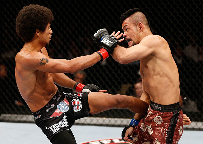 MACAU, MACAU - NOVEMBER 10:  (L-R) Alex Caceres kicks Motonobu Tezuka during their bantamweight bout at the UFC Macao event inside CotaiArena on November 10, 2012 in Macau, Macau.  (Photo by Josh Hedges/Zuffa LLC/Zuffa LLC via Getty Images)
