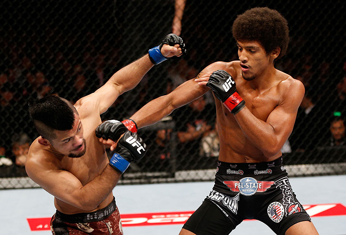 MACAU, MACAU - NOVEMBER 10:  (R-L) Alex Caceres punches Motonobu Tezuka during their bantamweight bout at the UFC Macao event inside CotaiArena on November 10, 2012 in Macau, Macau.  (Photo by Josh Hedges/Zuffa LLC/Zuffa LLC via Getty Images)