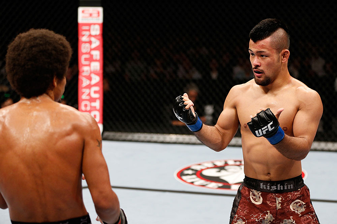 MACAU, MACAU - NOVEMBER 10:  (R-L) Motonobu Tezuka taunts Alex Caceres during their bantamweight bout at the UFC Macao event inside CotaiArena on November 10, 2012 in Macau, Macau.  (Photo by Josh Hedges/Zuffa LLC/Zuffa LLC via Getty Images)