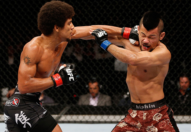 MACAU, MACAU - NOVEMBER 10:  (L-R) Alex Caceres punches Motonobu Tezuka during their bantamweight bout at the UFC Macao event inside CotaiArena on November 10, 2012 in Macau, Macau.  (Photo by Josh Hedges/Zuffa LLC/Zuffa LLC via Getty Images)