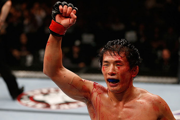 MACAU, MACAU - NOVEMBER 10:  Takeya Mizugaki reacts after defeating Jeff Hougland during their bantamweight bout at the UFC Macao event inside CotaiArena on November 10, 2012 in Macau, Macau.  (Photo by Josh Hedges/Zuffa LLC/Zuffa LLC via Getty Images)