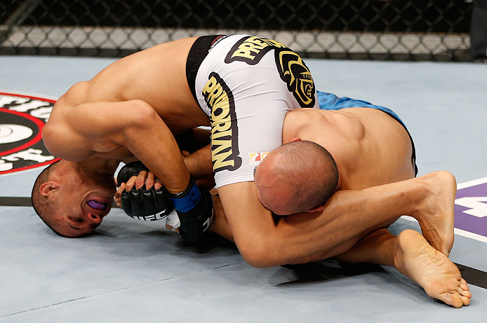 MACAU, MACAU - NOVEMBER 10: (L-R) Jon Tuck attempts an arm bar submission against Tiequan Zhang during their lightweight bout at the UFC Macao event inside CotaiArena on November 10, 2012 in Macau, Macau. (Photo by Josh Hedges/Zuffa LLC/Zuffa LLC via Getty Images)