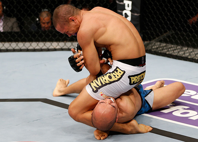 MACAU, MACAU - NOVEMBER 10: (L-R) Jon Tuck attempts an arm bar submission against Tiequan Zhang during their lightweight bout at the UFC Macao event inside CotaiArena on November 10, 2012 in Macau, Macau. (Photo by Josh Hedges/Zuffa LLC/Zuffa LLC via Getty Images)
