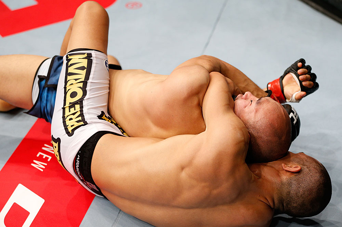 MACAU, MACAU - NOVEMBER 10: (R-L) Jon Tuck attempts a rear choke submission against Tiequan Zhang during their lightweight bout at the UFC Macao event inside CotaiArena on November 10, 2012 in Macau, Macau. (Photo by Josh Hedges/Zuffa LLC/Zuffa LLC via Getty Images)