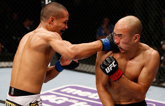 MACAU, MACAU - NOVEMBER 10: (L-R) Jon Tuck punches Tiequan Zhang during their lightweight bout at the UFC Macao event inside CotaiArena on November 10, 2012 in Macau, Macau. (Photo by Josh Hedges/Zuffa LLC/Zuffa LLC via Getty Images)