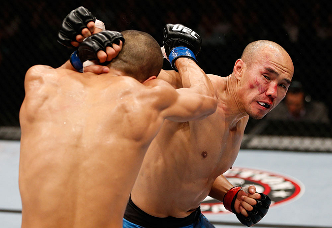 MACAU, MACAU - NOVEMBER 10: (R-L) Tiequan Zhang punches Jon Tuck during their lightweight bout at the UFC Macao event inside CotaiArena on November 10, 2012 in Macau, Macau. (Photo by Josh Hedges/Zuffa LLC/Zuffa LLC via Getty Images)