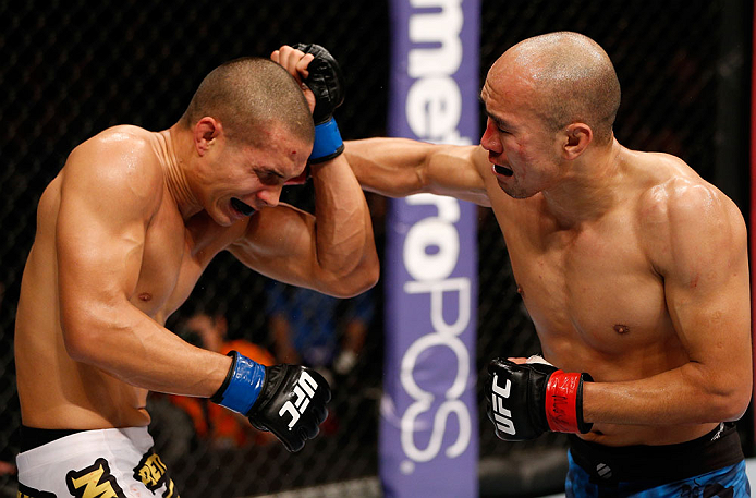 MACAU, MACAU - NOVEMBER 10: (R-L) Tiequan Zhang punches Jon Tuck during their lightweight bout at the UFC Macao event inside CotaiArena on November 10, 2012 in Macau, Macau. (Photo by Josh Hedges/Zuffa LLC/Zuffa LLC via Getty Images)