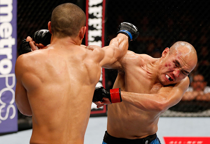 MACAU, MACAU - NOVEMBER 10: (L-R) Jon Tuck punches Tiequan Zhang during their lightweight bout at the UFC Macao event inside CotaiArena on November 10, 2012 in Macau, Macau. (Photo by Josh Hedges/Zuffa LLC/Zuffa LLC via Getty Images)