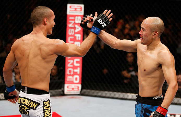 MACAU, MACAU - NOVEMBER 10: (L-R) Jon Tuck and Tiequan Zhang congratulate each other after their lightweight bout at the UFC Macao event inside CotaiArena on November 10, 2012 in Macau, Macau. (Photo by Josh Hedges/Zuffa LLC/Zuffa LLC via Getty Images)