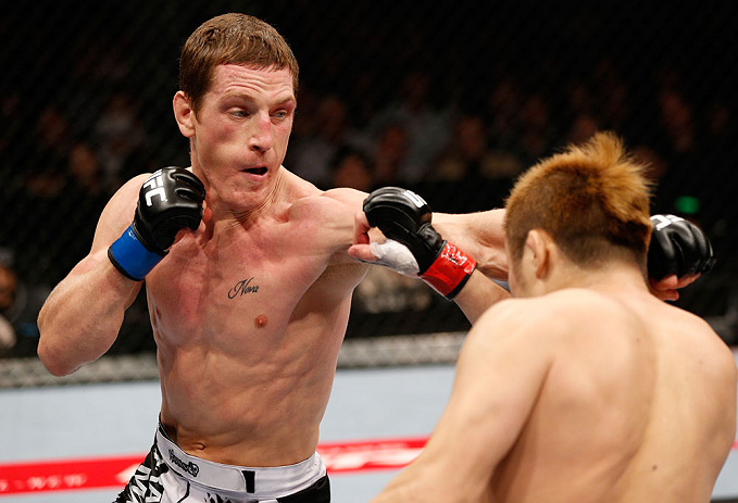MACAU, MACAU - NOVEMBER 10: (L-R) Mac Danzig punches Takanori Gomi during their lightweight bout at the UFC Macao event inside CotaiArena on November 10, 2012 in Macau, Macau. (Photo by Josh Hedges/Zuffa LLC/Zuffa LLC via Getty Images)