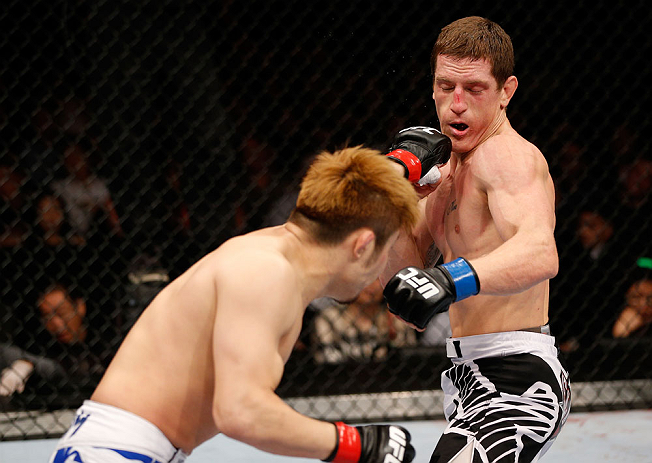 MACAU, MACAU - NOVEMBER 10: (L-R) Takanori Gomi punches Mac Danzig during their lightweight bout at the UFC Macao event inside CotaiArena on November 10, 2012 in Macau, Macau. (Photo by Josh Hedges/Zuffa LLC/Zuffa LLC via Getty Images)