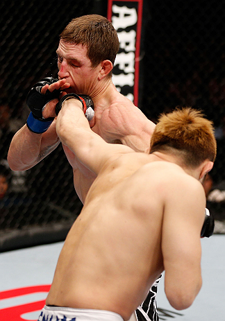 MACAU, MACAU - NOVEMBER 10: (R-L) Takanori Gomi punches Mac Danzig during their lightweight bout at the UFC Macao event inside CotaiArena on November 10, 2012 in Macau, Macau. (Photo by Josh Hedges/Zuffa LLC/Zuffa LLC via Getty Images)