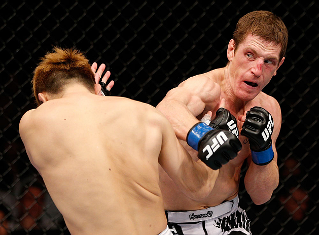 MACAU, MACAU - NOVEMBER 10: (R-L) Mac Danzig punches Takanori Gomi during their lightweight bout at the UFC Macao event inside CotaiArena on November 10, 2012 in Macau, Macau. (Photo by Josh Hedges/Zuffa LLC/Zuffa LLC via Getty Images)