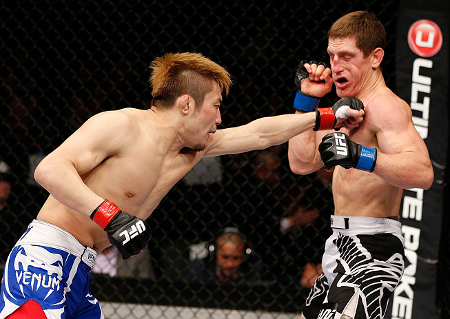 MACAU, MACAU - NOVEMBER 10: (L-R) Takanori Gomi punches Mac Danzig during their lightweight bout at the UFC Macao event inside CotaiArena on November 10, 2012 in Macau, Macau. (Photo by Josh Hedges/Zuffa LLC/Zuffa LLC via Getty Images)