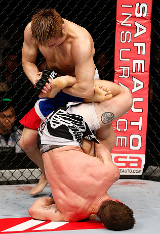 MACAU, MACAU - NOVEMBER 10: (L-R) Takanori Gomi and Mac Danzig trade leg lock attempts during their lightweight bout at the UFC Macao event inside CotaiArena on November 10, 2012 in Macau, Macau. (Photo by Josh Hedges/Zuffa LLC/Zuffa LLC via Getty Images)