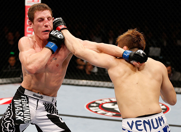 MACAU, MACAU - NOVEMBER 10: (R-L) Takanori Gomi and Mac Danzig trade punches during their lightweight bout at the UFC Macao event inside CotaiArena on November 10, 2012 in Macau, Macau. (Photo by Josh Hedges/Zuffa LLC/Zuffa LLC via Getty Images)