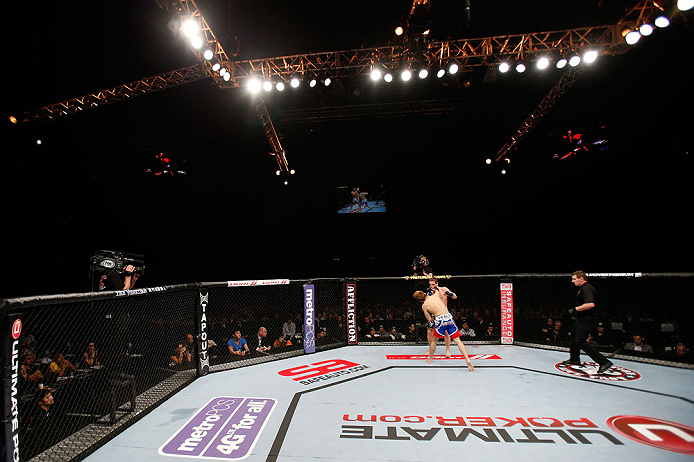 MACAU, MACAU - NOVEMBER 10: Takanori Gomi (blue shorts) punches Mac Danzig during their lightweight bout at the UFC Macao event inside CotaiArena on November 10, 2012 in Macau, Macau. (Photo by Josh Hedges/Zuffa LLC/Zuffa LLC via Getty Images)