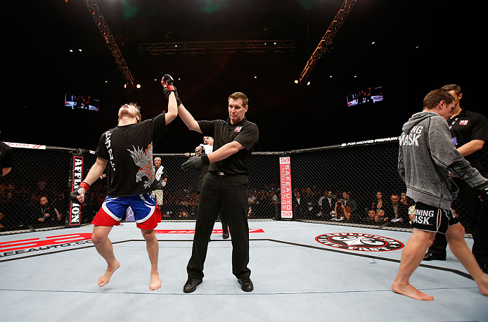 MACAU, MACAU - NOVEMBER 10: Takanori Gomi (L) reacts after defeating Mac Danzig during their lightweight bout at the UFC Macao event inside CotaiArena on November 10, 2012 in Macau, Macau. (Photo by Josh Hedges/Zuffa LLC/Zuffa LLC via Getty Images)